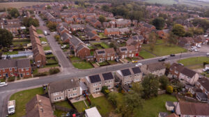 Aerial shot showing multiple homes with PV panels