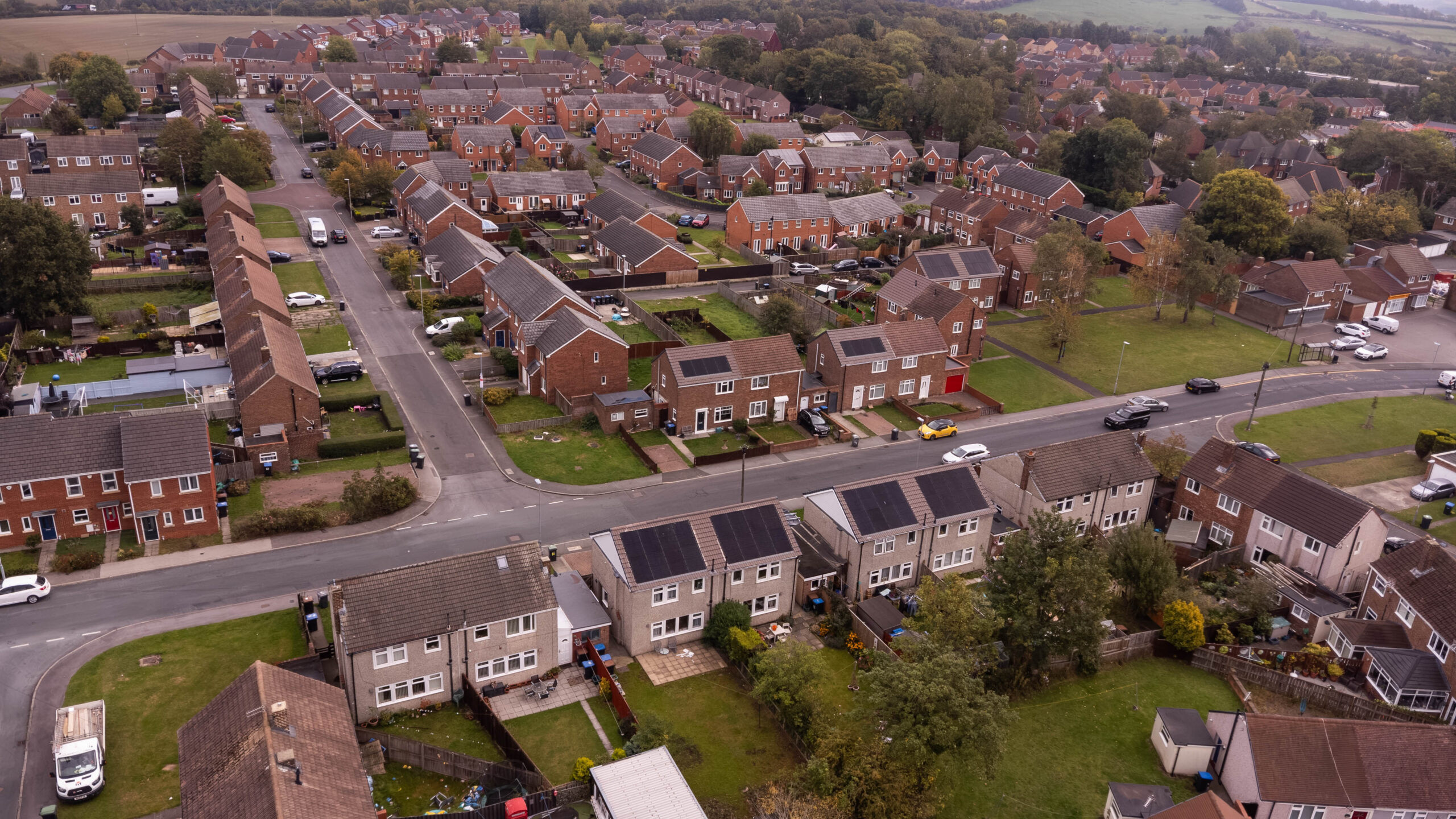Aerial shot showing multiple homes with PV panels