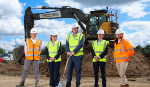 Team members from REGEN, Thirteen and Middlesbrough Council stand on a construction site to mark the start of works to build 40 new bungalows in Middlesbrough