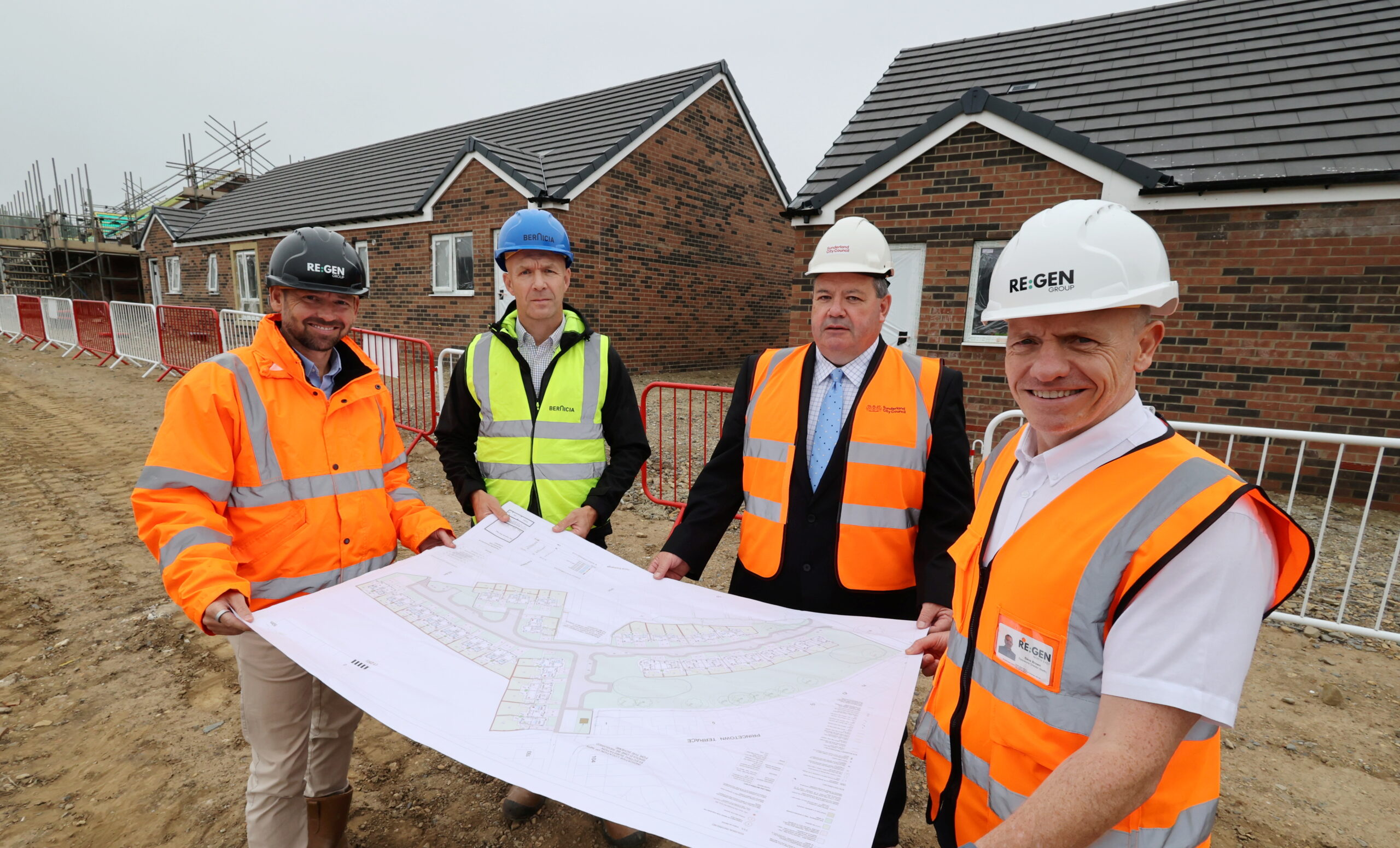 Team picture of four people from REGEN, Bernicia and Sunderland city council on a new build site in Sunderland
